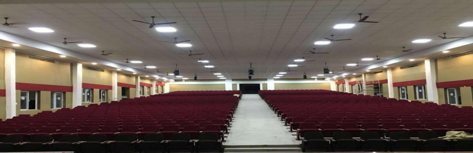 School Auditorium — Wall absorbers across a large seating hall